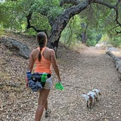 christel_oerum_walking_dog_along_path_in_forested_park_-_thumbnail Thumb